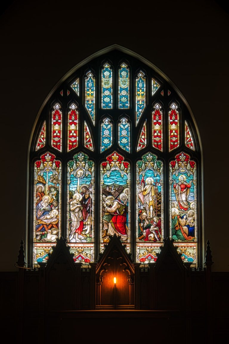 photo of blue and red religious stain glass decor