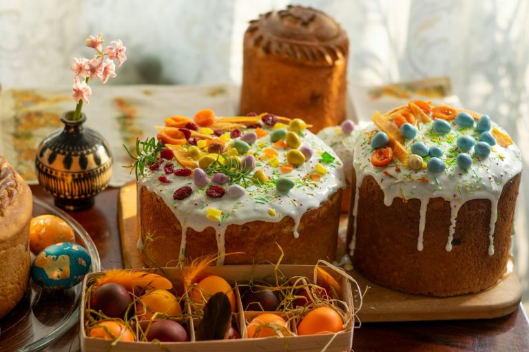 brown and white cake with orange fruits on top