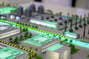 Miniature industrial complex with glowing lights